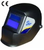 Auto-darkening welding helmet