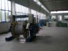 travelling type take-up and traversing stand for tubular strander